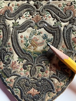 Close up of an original Shield Shape Purse with minute stiches