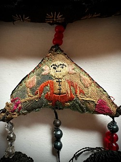 Close up image of embroidered hanging triangles on Chinese Ethnic Purse 20th zcentury